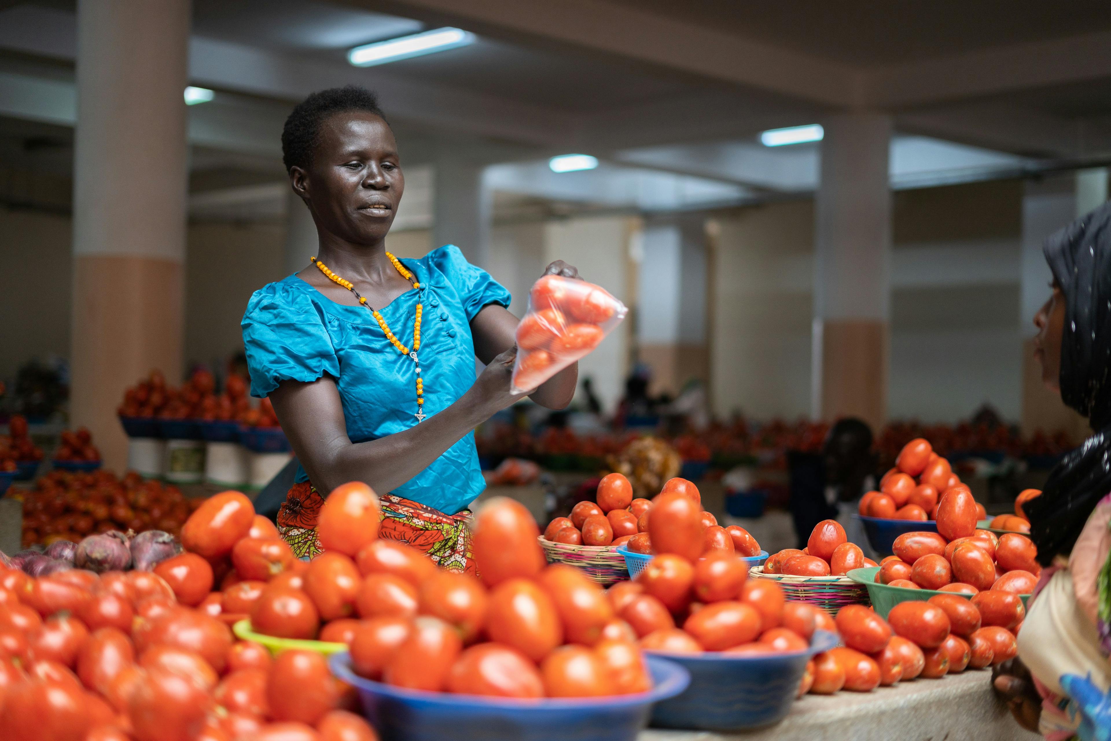Florence Anzaru (37) moved to Arua as a girl, and has been selling fresh produce here for 22 years. Women are the muscle behind much of Africa’s informal economy and cross-border trade, yet climate impacts could hit them particularly hard.  