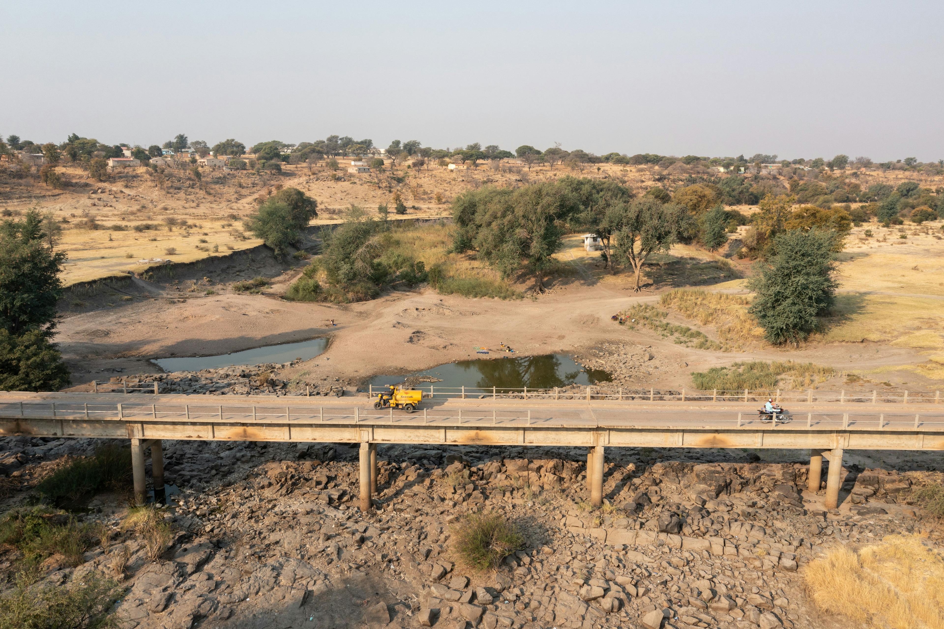A water seller crosses the drying river on his way to town. Water resources must be managed efficiently and sustainably using locally-tailored solutions to support the continent’s growing population.